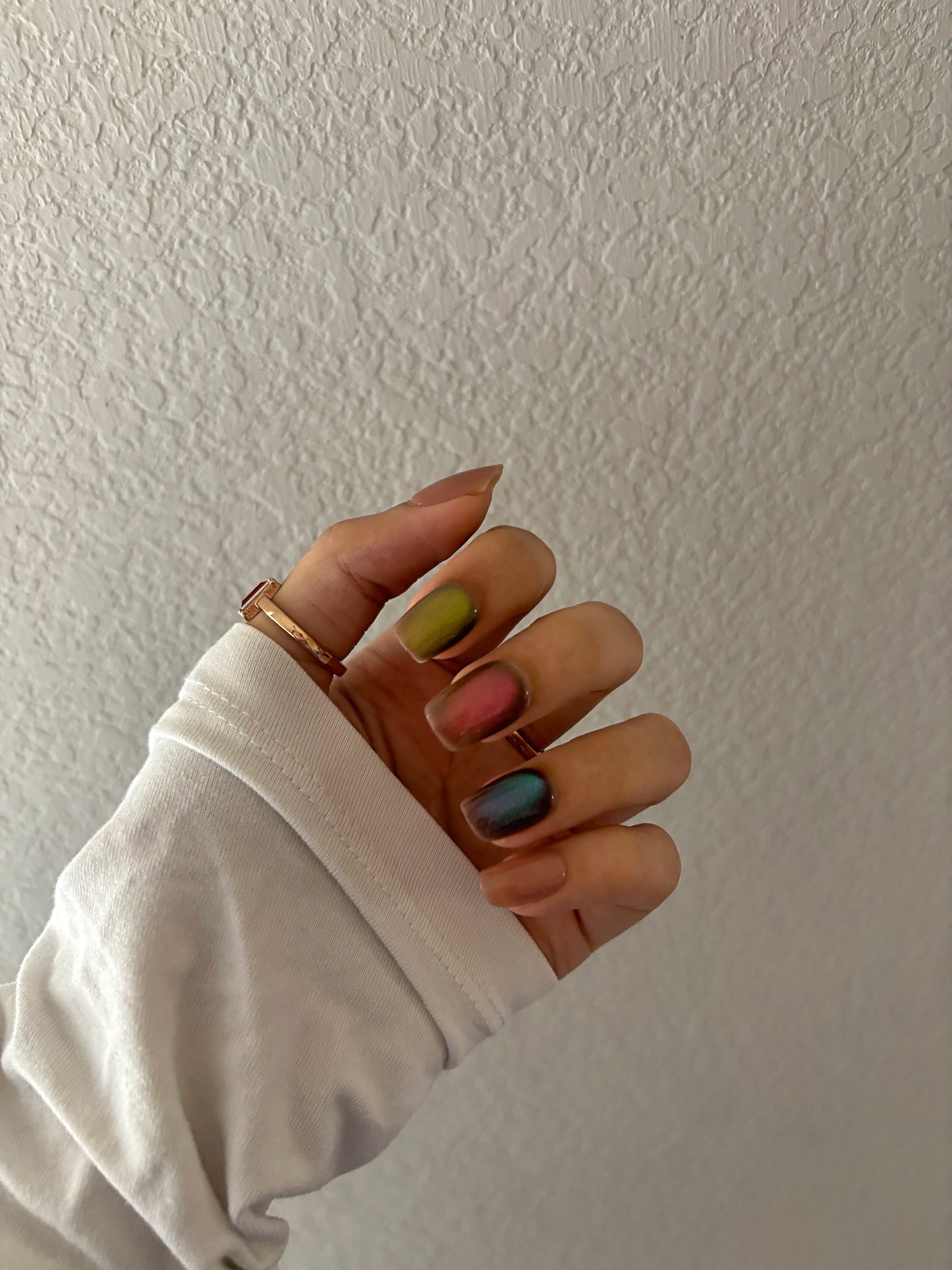 Colorful cat eye glitter nails, nude, blue, red, green glitter colors