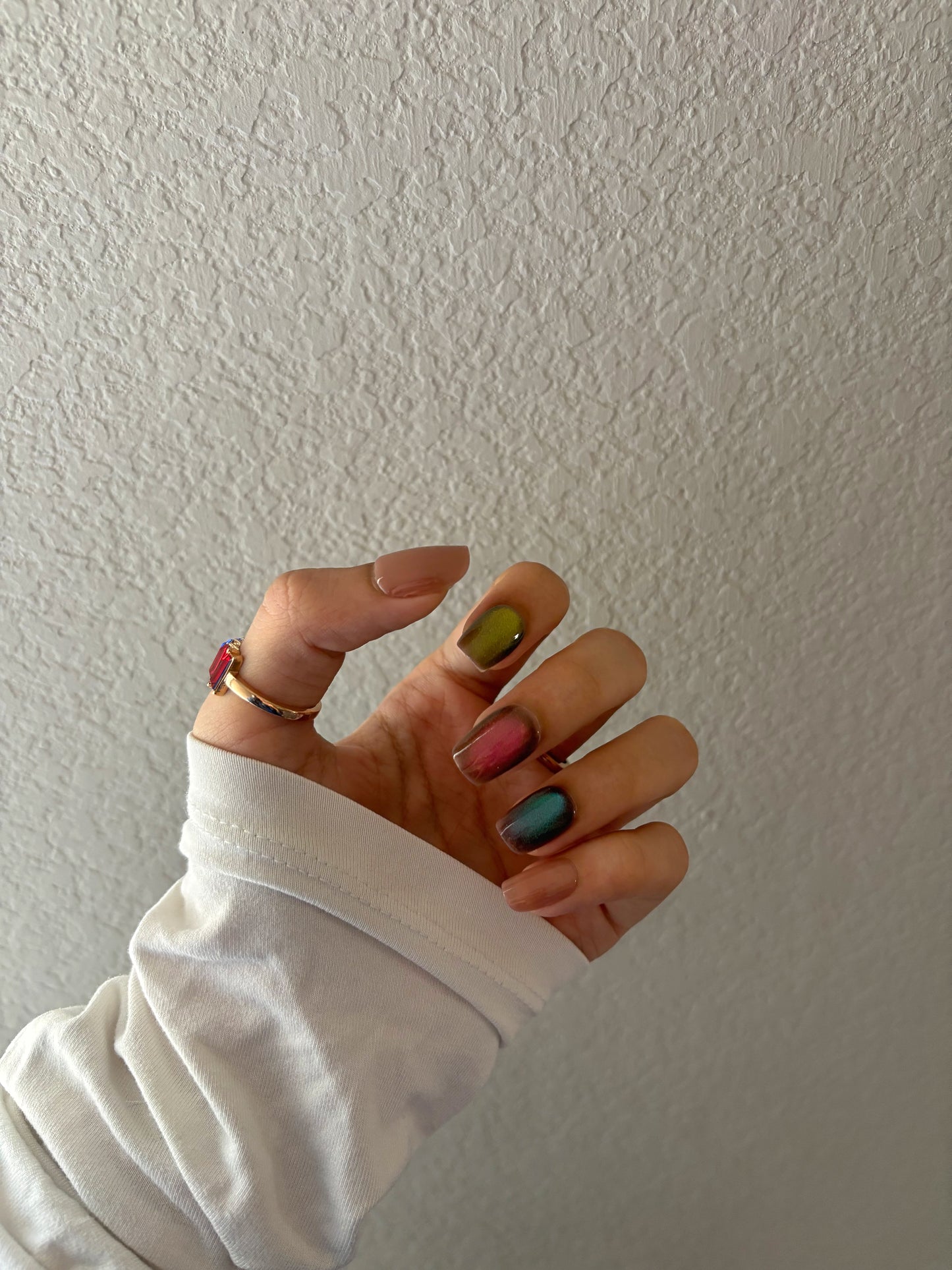 Colorful cat eye glitter nails, nude, blue, red, green glitter colors