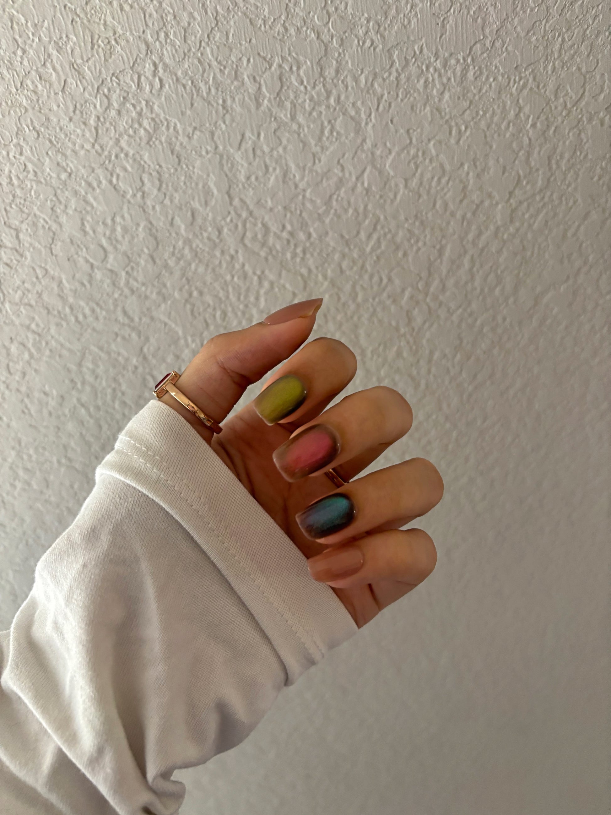 Colorful cat eye glitter nails, nude, blue, red, green glitter colors